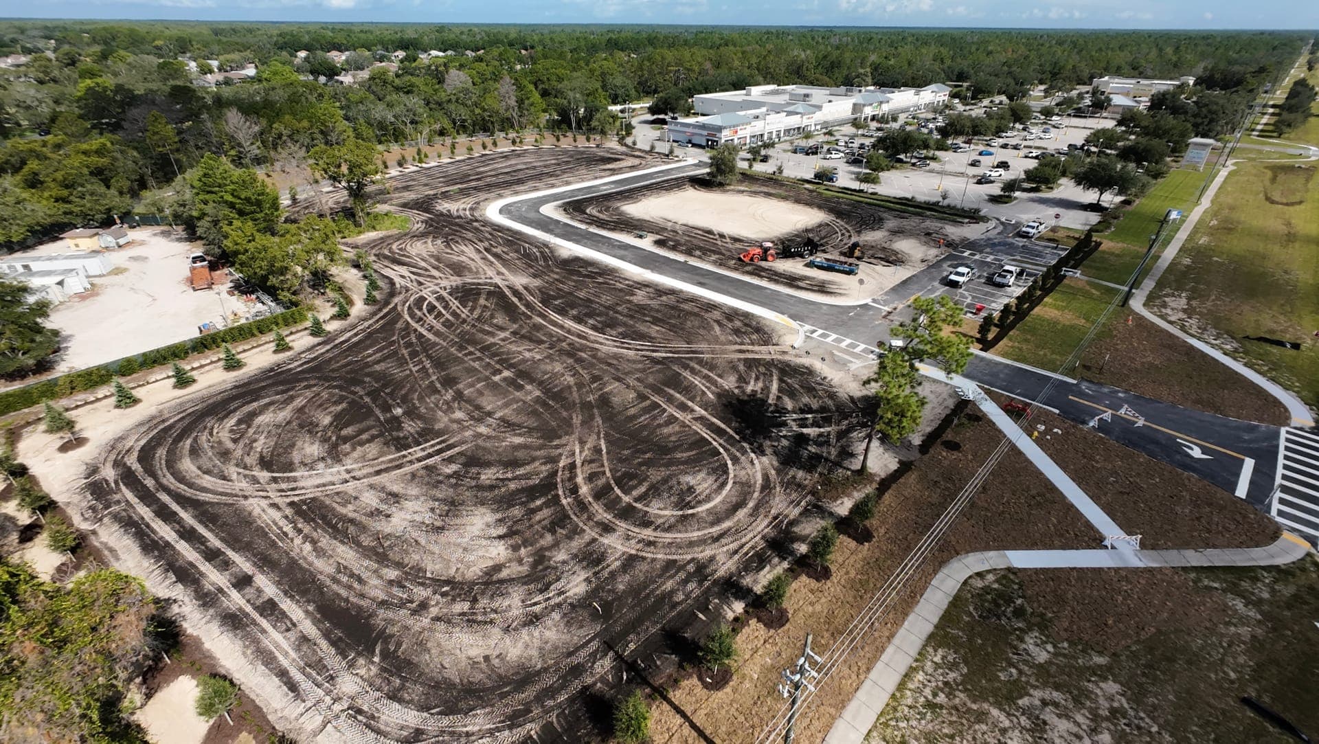 Aerial view of a large commercial lot graded and prepared by Joe Dirt Inc.
